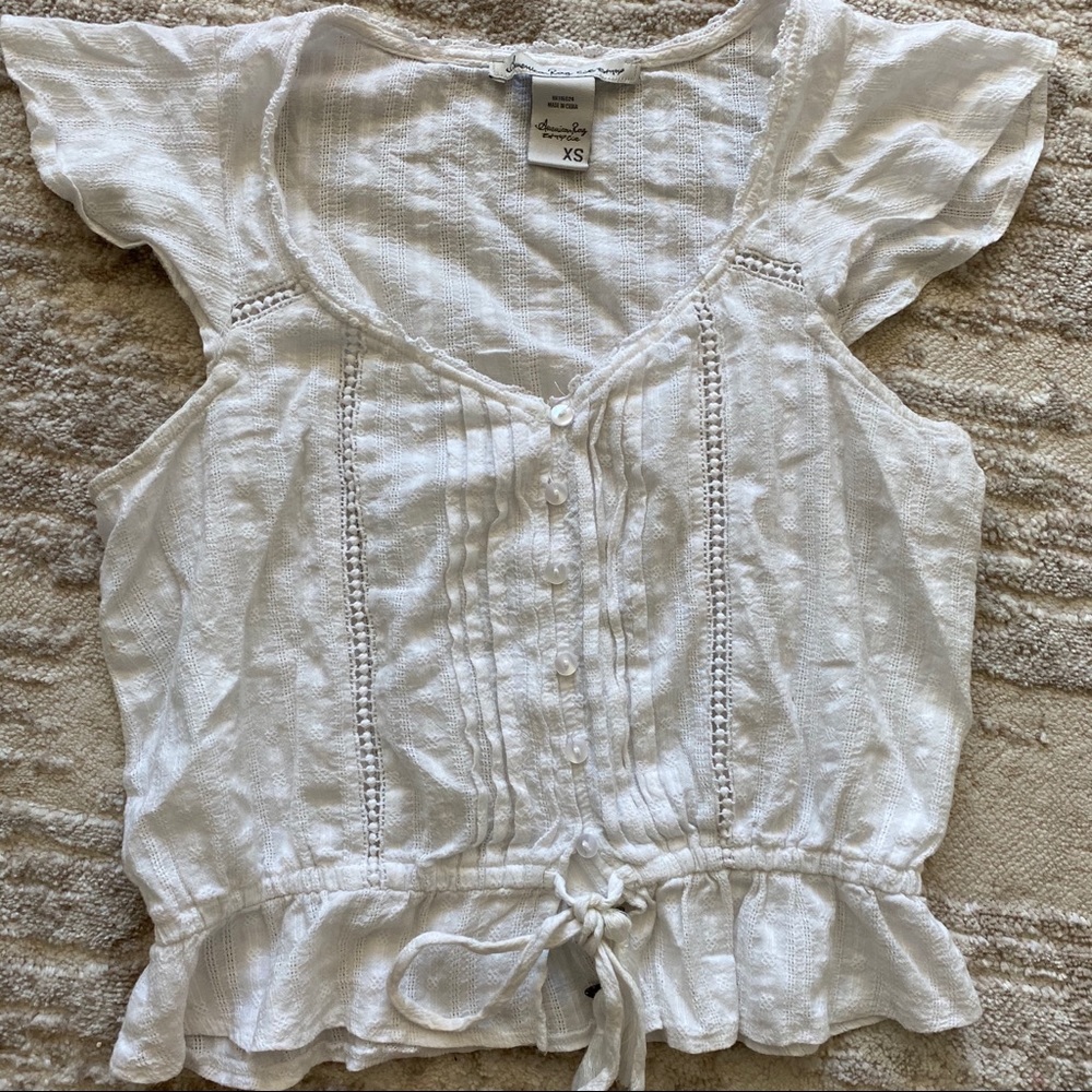 White ruffle shirt